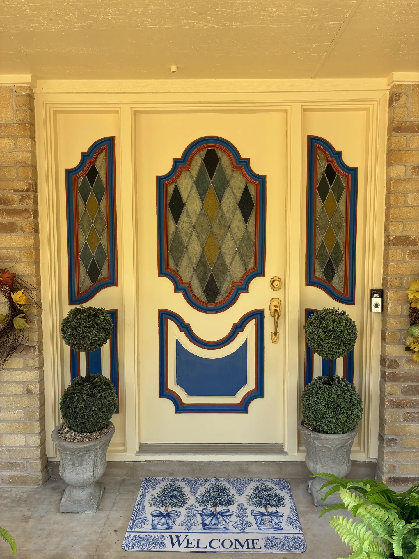 Painted front door with decorative glass