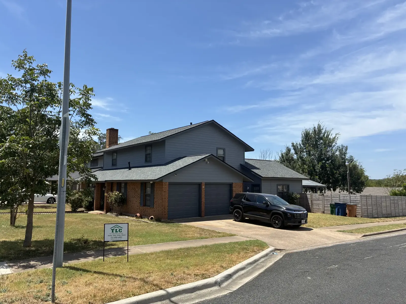 Gray sided house with a covered front entrance