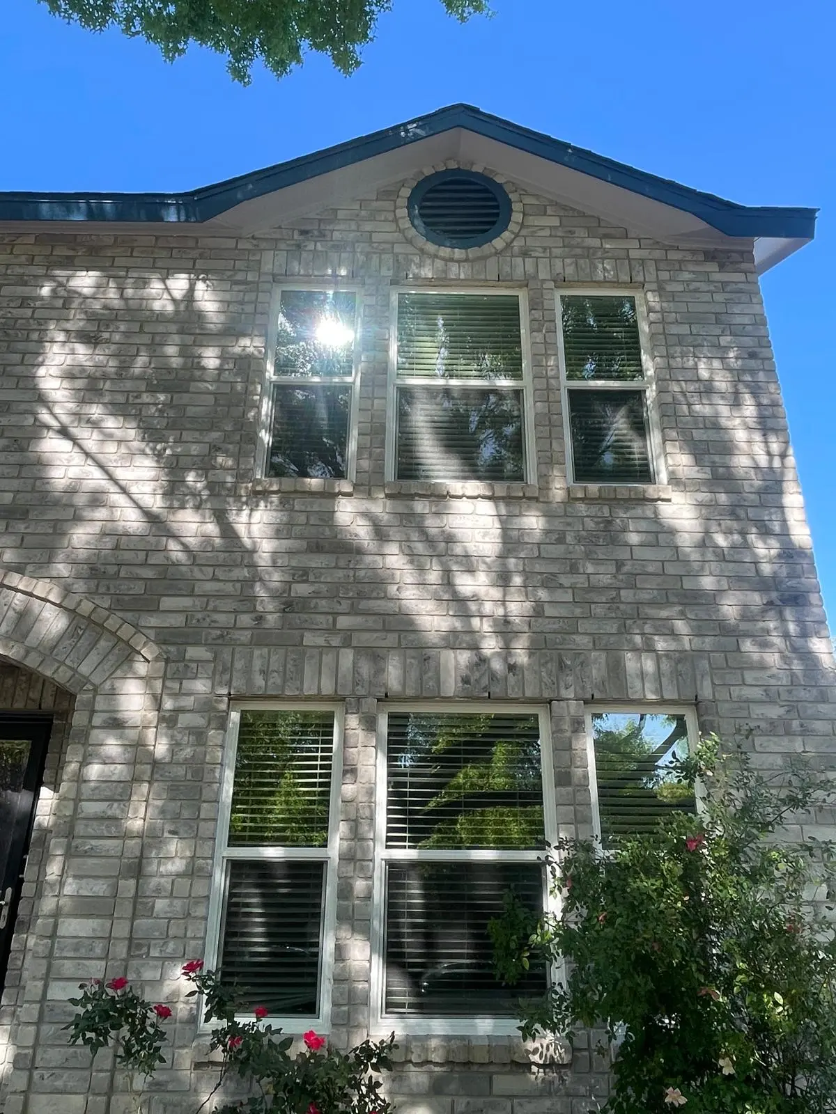 Windows on a two-story brick exterior