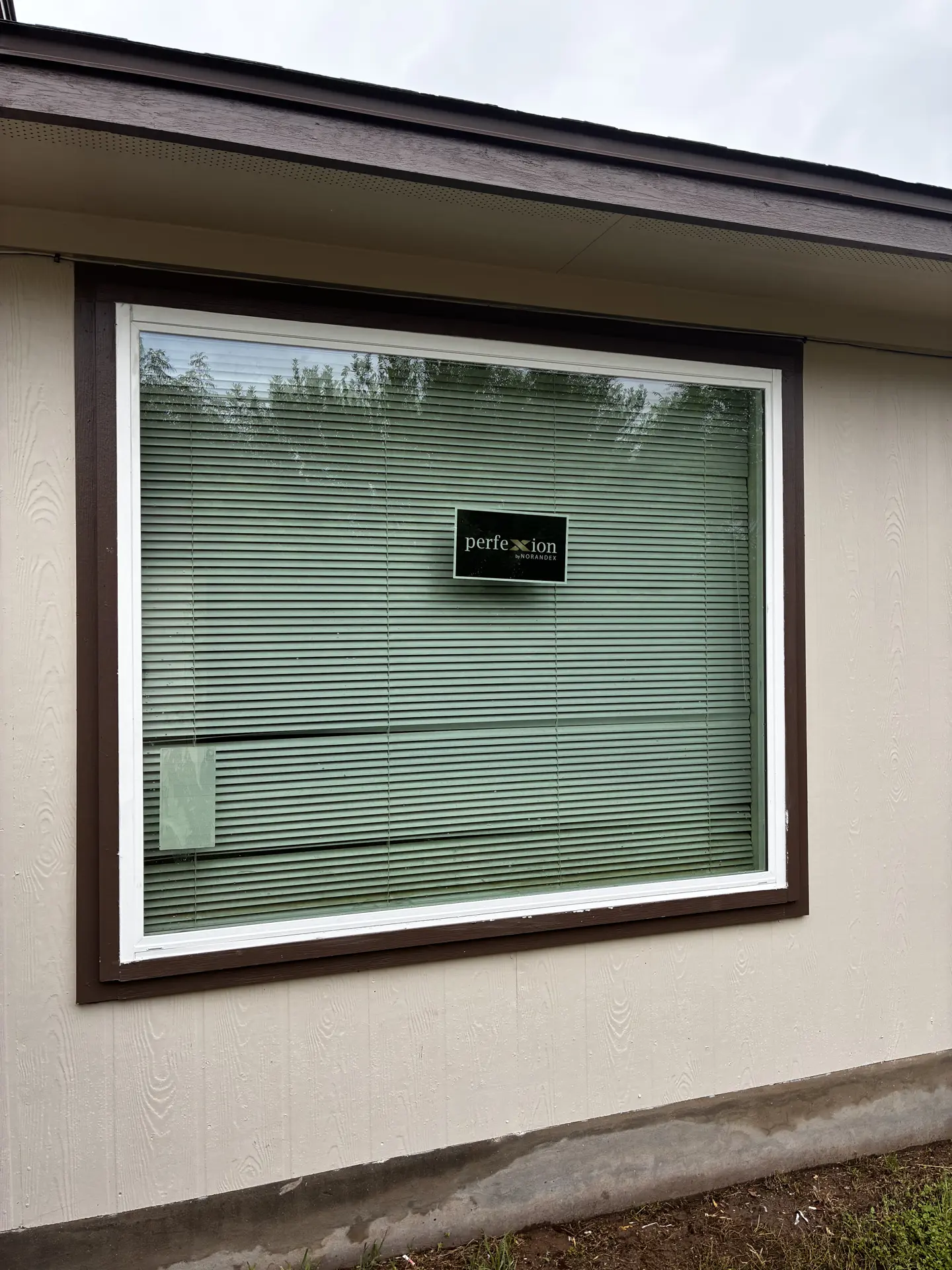 Picture window set in light stucco